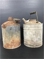 Pair of antique rustic oil cans
