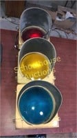 Old real stoplight. blue light, metal & glass