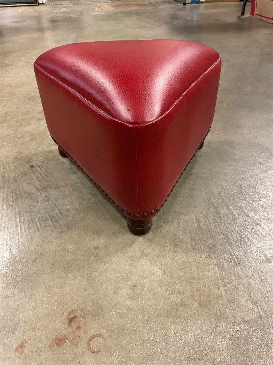 Triangle stool with studded bottom