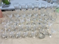 Large grouping of wine and liquor glasses