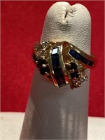 14 K gold ring. Diamonds and another black