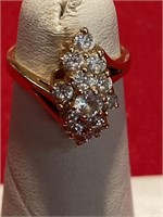 14 karat gold ring. Size 3 3/4. The stones are