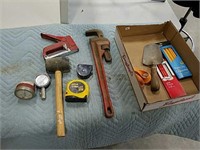 Ridgid 18" pipe wrench, tape measures, stapler