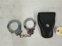 Handcuffs in leather holster