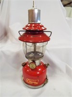 Red Coleman Model 210 A Lantern in a Metal Case