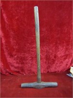 Antique railroad spike hammer.