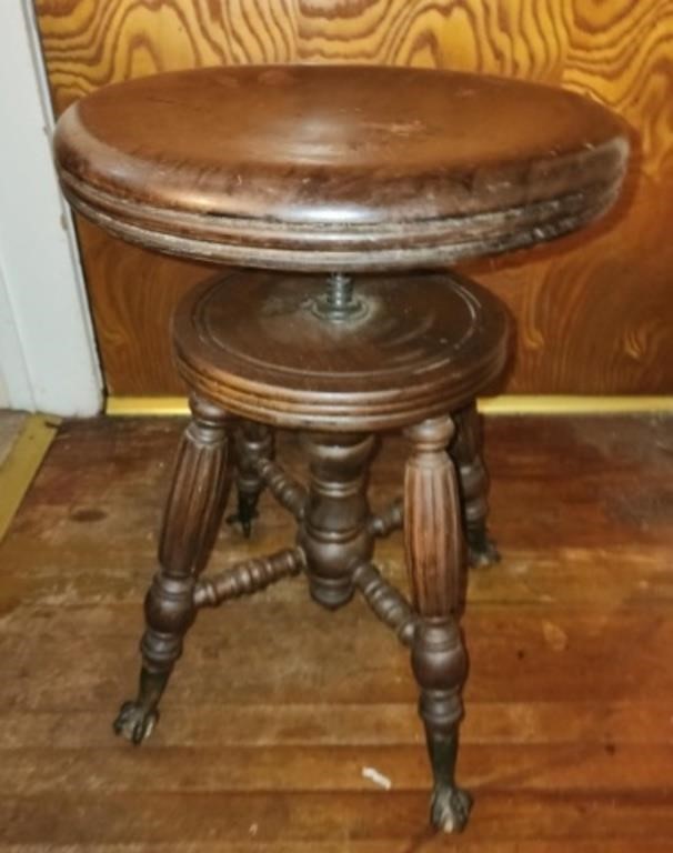 Antique wooden claw foot swivel stool
