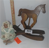 wooden carousel horse, tiny porcelain doll