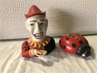 Lady bug coin bank, smiling cast  clown coin bank.