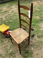 Ladder back chair with minor damage to one rung