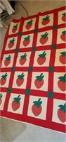 Handmade and hand quilted strawberry quilt this