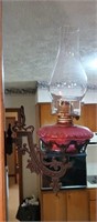 Hanging oil lamp with holder moves from side to