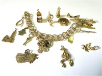 10k gold charm bracelet with eight 10k gold charms