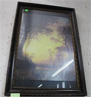 Framed poster of deer feeding in open wooded area