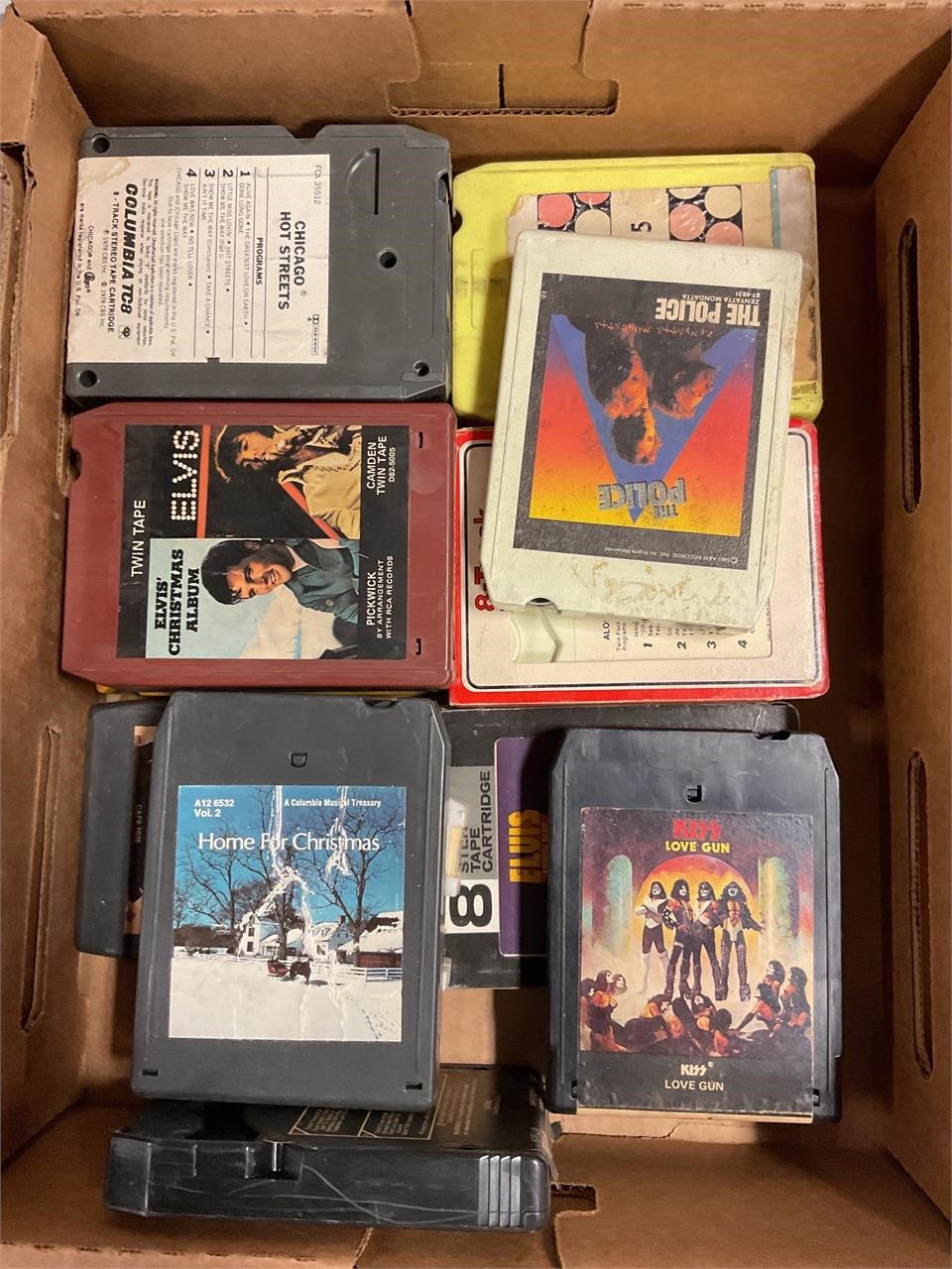 Box of assorted eight track tapes