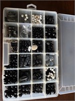 Box of beads for jewelry making.