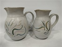 2 pottery pitchers