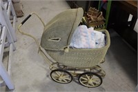 Antique wicker stroller with blankets