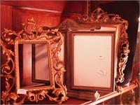 Two vintage free-standing brass ornate picture