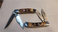 2 wild turkey pocket knives surgical steel