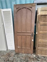 The fanciest antique wood front door of the