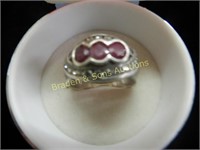 LADIES STERLING SILVER AND RED RUBY RING.