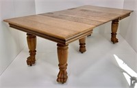 Oak extension table, animal claw feet have