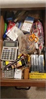 Contents of utility drawer, calculator, pins