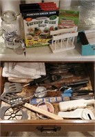 Contents of kitchen utensil drawer, jars, bags