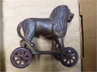 Antique cast iron lion toy