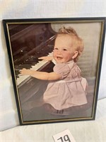 Baby Girl Playing Piano Framed Print