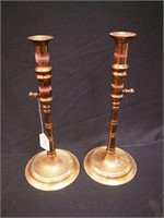 Pair of brass push-up candlesticks