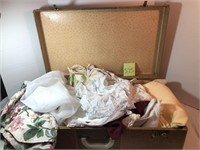 Suitcase full of linens