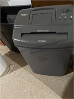 2 Paper shredders and a trash can with cords in