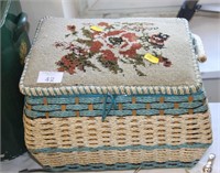 Sewing basket with tapestry top.