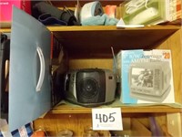 Right side shelf: 2 portable b/w TVs - Magnavox