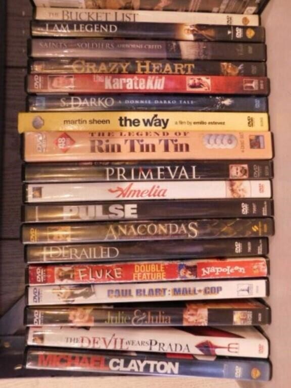 DVD movies & VHS tapes in half round bookcase