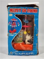BATTERY OPERATED MERRY GO ROUND BEAR W/ BOX