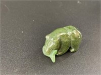 Alaskan Kobuk jade carved bear who has caught a la