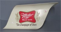 Miller beer sign. Measures: 10.5" H x 24.5" W.