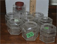 9 small plastic holders