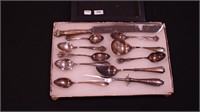 Eight pieces of sterling silver flatware, and