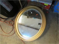 APPROX 27X23 VINTAGE OVAL GOLD FRAME MIRROR