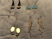 Five pairs of earrings and a beaded bracelet