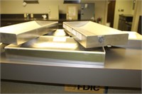 Five stainless steel pass-through trays