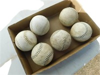 Six softballs.