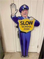 Policeman slow school zone sign