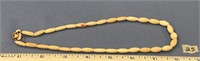 14" strand of cylinder shaped ivory bead necklace
