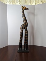 Wooden giraffe sculpture
