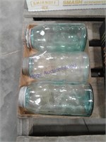 3 blue glass jars